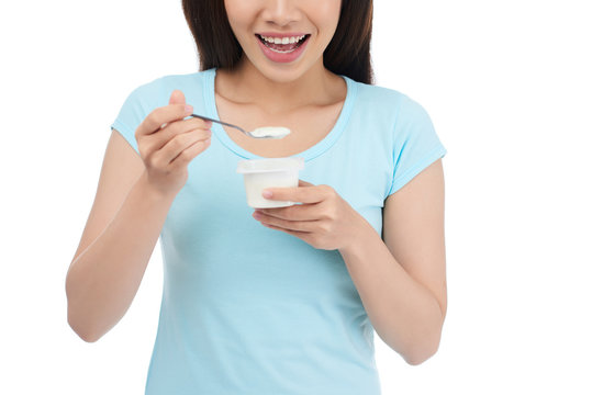 Smiling Woman Eating Yogurt