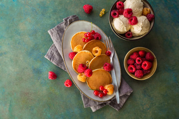Freshly baked pancakes with raspberries
