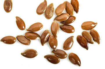 Close up of flax seeds isolated on white background