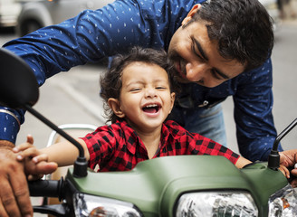 Young Indian boy riding the motobike