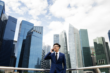Fototapeta na wymiar Asian businessman in a city