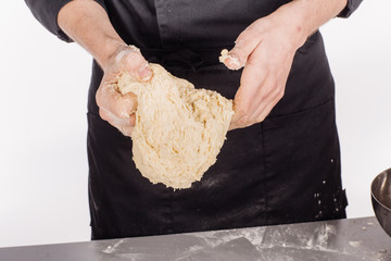 chef or baker making dough at bakery