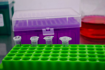 A liitle cell container on a holder