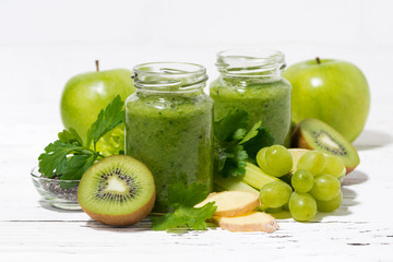 green fruit and vegetable smoothies in jars