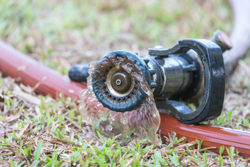 water splashing from high pressure fire hose nozzle after use