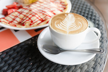 Strawberry crape cake with coffee