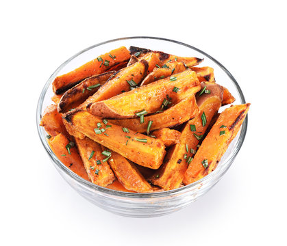 Baked sweet potato in glass bowl isolated on white background.