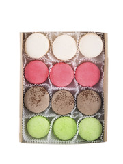 a box of multi-colored cookies isolated on white