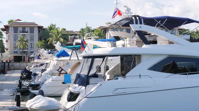 Big Luxery Yatch Boats Parked in Laguna. 4K. Phuket, Thailand.