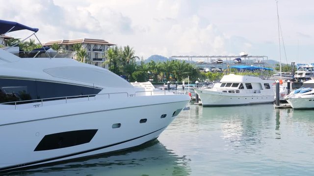 Big Luxery Yatch Boats Parked in Marina. 4K. Phuket, Thailand.