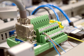 Blurred and de-focus electrical terminal block ( connector ) with wires on the electronic board. 