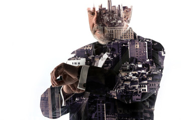 Portrait of bearded businessman. Double exposure city on the background.