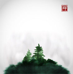 Obraz premium Stylized black ink wash painting with pine trees on green hill in mist. Traditional oriental ink painting sumi-e, u-sin, go-hua. Hieroglyph - zen.