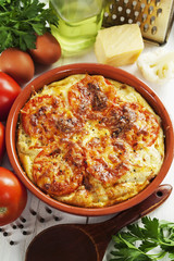 Cauliflower baked with tomato, cheese and eggs