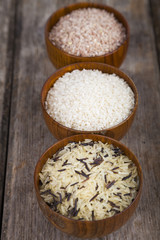Three bowls with different varieties of rice