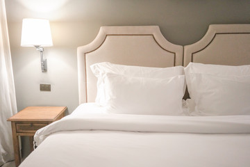 White pillow on bed decoration in vintage  bedroom interior