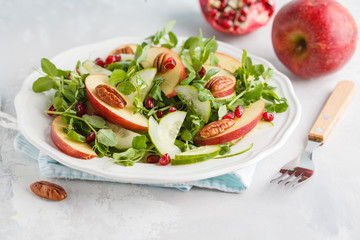 Light green apple pecan pomegranate salad. Vegan Healthy Food Concept.