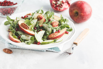Light green apple pecan pomegranate salad. Vegan Healthy Food Concept.