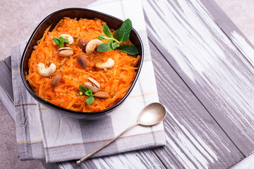 Indian carrot Gajar halwa. Copyspace, top view, flatlay.