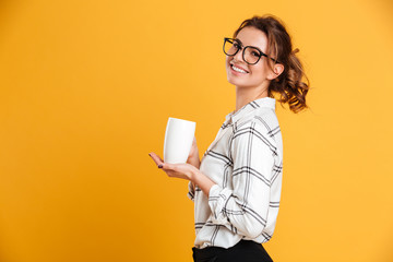Beautiful young woman drinking tea.
