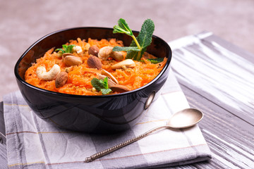 Indian carrot Gajar halwa. Copyspace, horizontal view, flatlay.