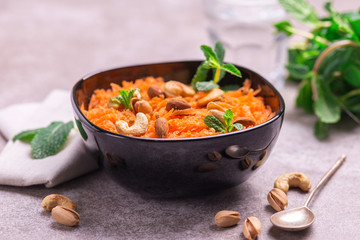Indian carrot Gajar halwa. Copyspace, horizontal view, flatlay.