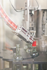 Manufacture of vodka. conveyor with glass bottles.