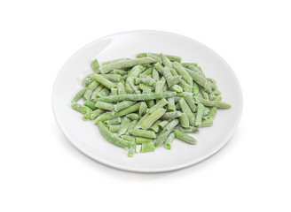 Frozen green beans on dish on a white background