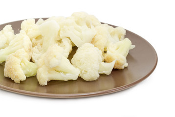 Frozen cauliflower on the brown dish with selective focus