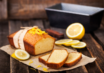 Classic lemon pound cake on rustic wooden background