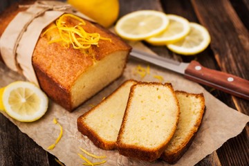 Classic lemon pound cake on rustic wooden background
