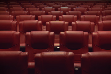 empty theater auditorium or movie cinema with red seats