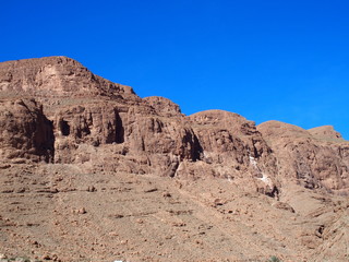 Fototapeta na wymiar Rocky slope of TODGHA GORGE canyon landscape in MOROCCO, eastern part of High Atlas Mountains range at Dades Rivers