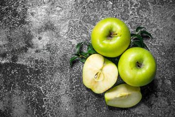 Green apples with leaves.