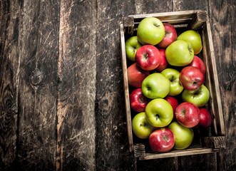 box with fresh red and green apples.