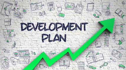 Development Plan Drawn on Brick Wall. 