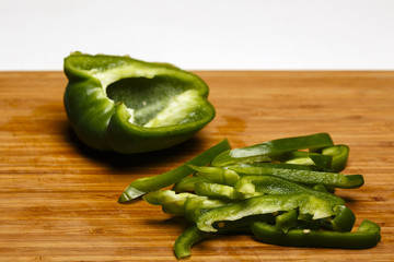 Fresh green pepper on the wood chipper