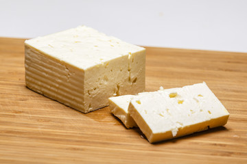 Telemea - Romanian cheese on wooden background