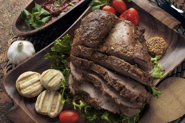 Assorted delicious grilled meat with vegetable over the coals on a barbecue