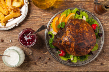 Baked ham, served on an old plate.
