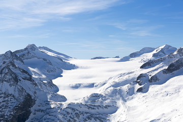 landscape of mountains in winter with blue sky