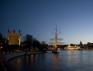 Fototapeta na wymiar Evening view of ship and houses in Stockholm a winter day