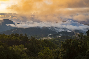 layers mountains of tropical forest in morning sunset