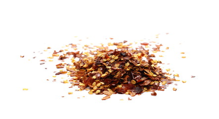 Crushed dry, spicy pepper, chili flakes and seeds isolated on white background