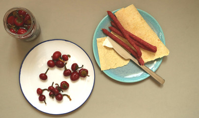 red cherry pepper for lunch and grilled sausages with bread