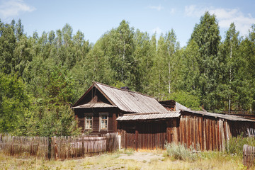 Old wooden village house in the forest
