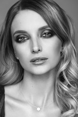 Fototapeta premium Beauty portrait of woman with perfect makeup. Black and white