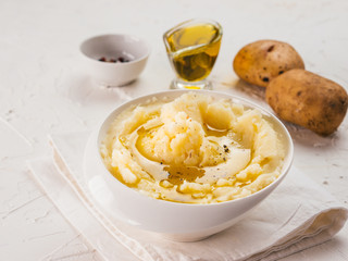 Mashed potatoes on white concrete background