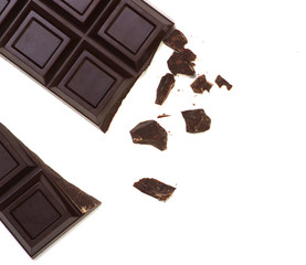 Broken chocolate bar isolated on white