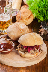Pulled pork sandwich with red cabbage and bbq sauce